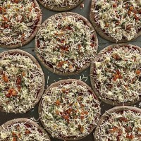 Dicoccum wholegrain Pizza with Cretan graviera, tomato & fresh basil pesto